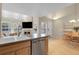 Spacious kitchen area with stainless steel dishwasher, open to living spaces, and a functional layout for easy meal preparation at 843 Snowberry St, Longmont, CO 80503