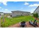 Expansive backyard featuring green grass, seating, and well-maintained landscaping at 5290 Silver Hare Ct, Castle Rock, CO 80104