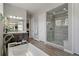 Modern bathroom with a walk-in shower, double vanity, and luxury soaking tub at 5290 Silver Hare Ct, Castle Rock, CO 80104