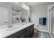 Elegant bathroom featuring double sinks, white countertops, and decorative accents at 5290 Silver Hare Ct, Castle Rock, CO 80104
