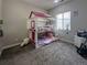 Cozy bedroom featuring a whimsical bunk bed with bright accents and a window view at 5290 Silver Hare Ct, Castle Rock, CO 80104