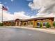 Community clubhouse with professional landscaping and American flag at 5290 Silver Hare Ct, Castle Rock, CO 80104