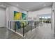 Entryway to open floor plan, hardwood floors, modern railings, and open sightlines to the outside at 5290 Silver Hare Ct, Castle Rock, CO 80104