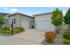 Attractive home with a three-car garage, stone accents, and well-maintained landscaping at 5290 Silver Hare Ct, Castle Rock, CO 80104