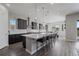 Beautiful kitchen with a large island, bar seating, modern appliances, and abundant natural light at 5290 Silver Hare Ct, Castle Rock, CO 80104