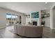 Cozy living room with a modern fireplace and access to an outdoor deck at 5290 Silver Hare Ct, Castle Rock, CO 80104