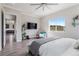 Cozy main bedroom featuring gray wood floors and a view of the neighborhood at 5290 Silver Hare Ct, Castle Rock, CO 80104