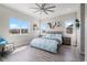 Bright and airy main bedroom with large windows and a ceiling fan at 5290 Silver Hare Ct, Castle Rock, CO 80104