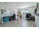 Well-lit home office featuring hardwood floors, natural light, and multiple work stations at 5290 Silver Hare Ct, Castle Rock, CO 80104