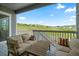 Covered deck with outdoor seating and picturesque views of the surrounding landscape at 5290 Silver Hare Ct, Castle Rock, CO 80104