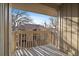 Balcony overlooking neighborhood and blue sky with trees and railings creating appealing shadows at 4068 S Atchison Way # 301, Aurora, CO 80014