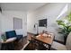 Cozy home office featuring a modern desk, chair, wood floors and a bright light at 4068 S Atchison Way # 301, Aurora, CO 80014