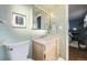 Fresh bathroom features a toilet, and vanity with modern fixtures and decor at 7380 Tabor St, Arvada, CO 80005