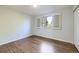 Bright bedroom features a window and hardwood floors at 7380 Tabor St, Arvada, CO 80005