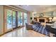 Comfortable living room features a fireplace and sliding glass doors to an outdoor patio at 7380 Tabor St, Arvada, CO 80005