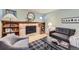 Inviting living room with a fireplace, bookshelves, and stylish decor at 7380 Tabor St, Arvada, CO 80005