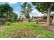 Spacious backyard with lush grass, wooden fence, and storage shed at 1161 S Johnson Way, Lakewood, CO 80232
