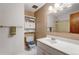 This cozy bathroom is complete with a white vanity, toilet, and shower with tub at 1161 S Johnson Way, Lakewood, CO 80232