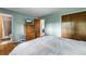 This well-lit primary bedroom has hardwood floors, generous closet space, and ensuite access at 1161 S Johnson Way, Lakewood, CO 80232
