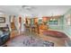 Open concept living room and kitchen with hardwood floors and staircase at 1161 S Johnson Way, Lakewood, CO 80232