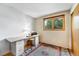 Office with large desk, hardwood floors, and a sunlit window at 1161 S Johnson Way, Lakewood, CO 80232