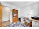 Office featuring desk and bookshelf with hardwood floor and natural light at 1161 S Johnson Way, Lakewood, CO 80232