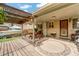 Covered patio with wooden deck, pergola, and outdoor seating, perfect for entertaining at 1161 S Johnson Way, Lakewood, CO 80232