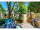 Cozy backyard with a grill, comfortable seating, and lush greenery, perfect for outdoor entertaining at 1711 Cato Cir # 21, Lafayette, CO 80026