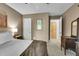 Bedroom with neutral walls and furnishings, carpet, and various antique wooden furnishings at 1711 Cato Cir # 21, Lafayette, CO 80026