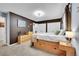This is a brown bedroom with built-in wooden drawers beneath the bed frame and lots of storage at 1711 Cato Cir # 21, Lafayette, CO 80026