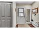 Welcoming foyer with closet, wood floors, and mirror, creating a functional entry space at 1711 Cato Cir # 21, Lafayette, CO 80026