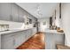 Modern kitchen features gray cabinets, stainless steel appliances, and wood-look flooring at 1711 Cato Cir # 21, Lafayette, CO 80026