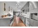 A modern, galley kitchen featuring stainless steel appliances, ample counter space, and plenty of storage at 1711 Cato Cir # 21, Lafayette, CO 80026