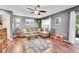 Cozy living room featuring a sectional sofa, decorative rug, and a ceiling fan for added comfort at 1711 Cato Cir # 21, Lafayette, CO 80026