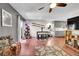 Bright living room with hardwood floors, a dining area, and access to the kitchen at 1711 Cato Cir # 21, Lafayette, CO 80026