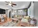 Comfortable living room features modern ceiling fan, stylish decor, and an abundance of natural light at 1711 Cato Cir # 21, Lafayette, CO 80026