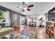 Open-concept living room with hardwood floors, stylish decor, and a ceiling fan at 1711 Cato Cir # 21, Lafayette, CO 80026