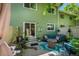Charming outdoor patio featuring cozy seating, potted plants, and a sliding glass door to a home's interior at 1711 Cato Cir # 21, Lafayette, CO 80026