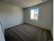 Simple bedroom with neutral carpeting and a window at 6608 N Nepal Ct, Aurora, CO 80019