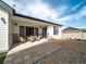 Outdoor patio area with modern furniture, stone accents, and seamless indoor-outdoor flow at 21925 E 51St St, Aurora, CO 80019