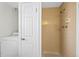 Basement bathroom with shower, washer, and dryer at 3124 W 9Th Avenue Pl, Broomfield, CO 80020