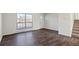 Bright living room with wood-look floors and access to the outdoors at 3124 W 9Th Avenue Pl, Broomfield, CO 80020