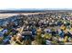 Aerial view of a residential neighborhood with mountain views at 17725 E 99Th Ave, Commerce City, CO 80022