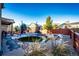 Landscaped backyard with a trampoline at 17725 E 99Th Ave, Commerce City, CO 80022