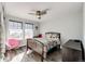 Charming bedroom with a full-size bed and plenty of natural light at 17725 E 99Th Ave, Commerce City, CO 80022