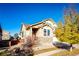 Two-story house with stone and siding exterior, attached garage, and landscaping at 17725 E 99Th Ave, Commerce City, CO 80022