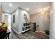 Bright hallway with modern shelving and staircase at 17725 E 99Th Ave, Commerce City, CO 80022