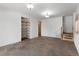 Finished basement with tile floors and built-in shelving at 721 Aspen Way, Evergreen, CO 80439