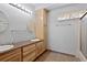 Basement bathroom with double vanity and shower at 721 Aspen Way, Evergreen, CO 80439