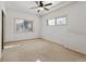 Basement bedroom with carpet, ceiling fan, and window at 721 Aspen Way, Evergreen, CO 80439